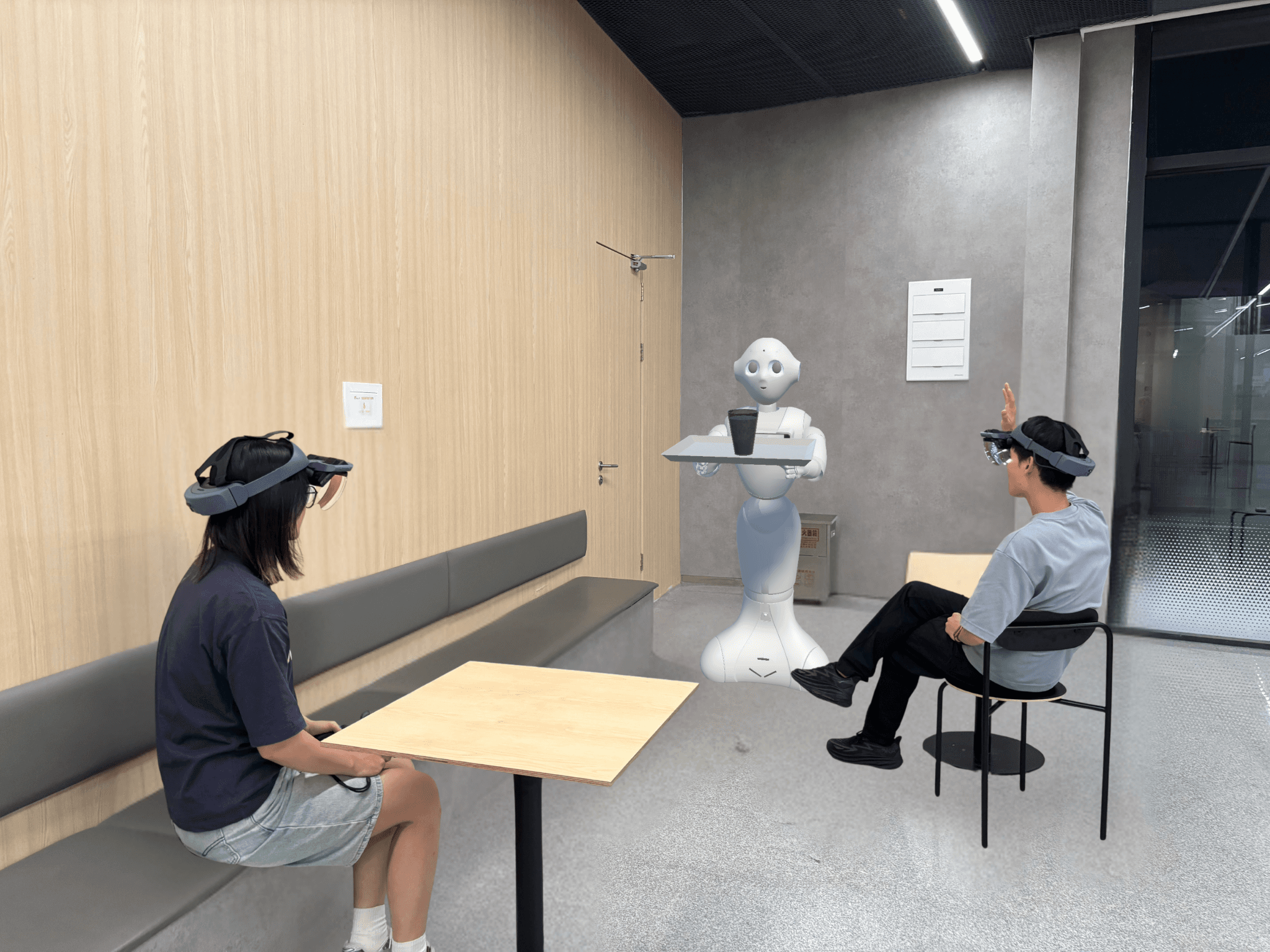 Managing Multi-User Interruptions in Human–Robot Interaction